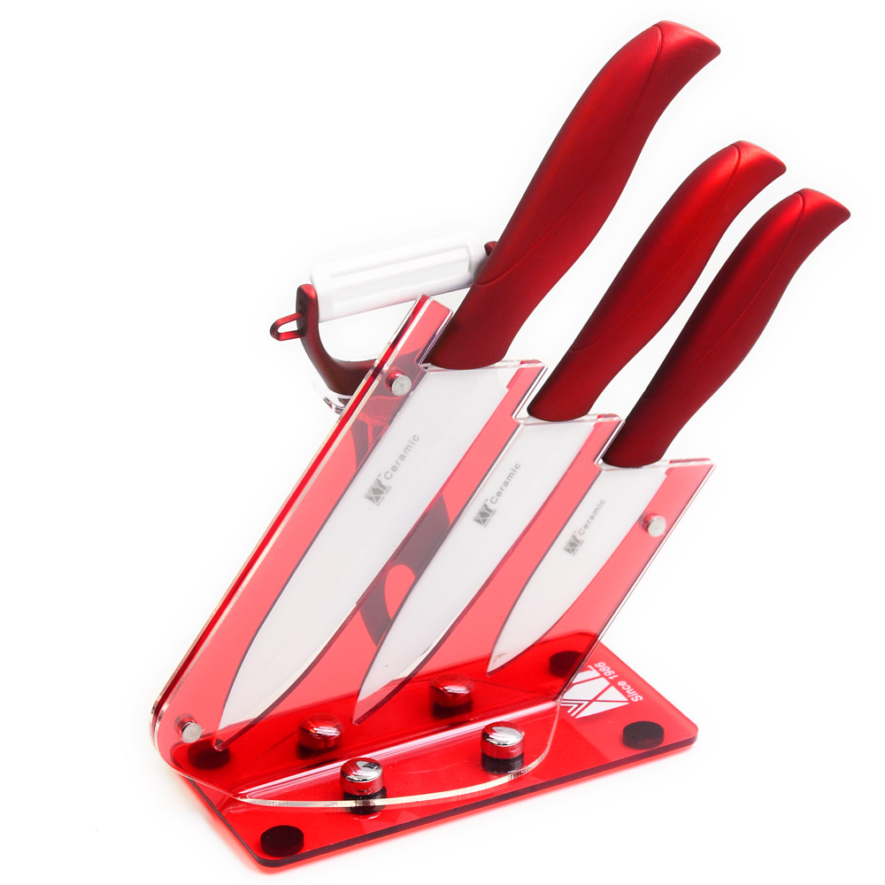 Three Piece Ceramic Knives Gift Set Plus Peeler And Red Acrylic Knives Hold